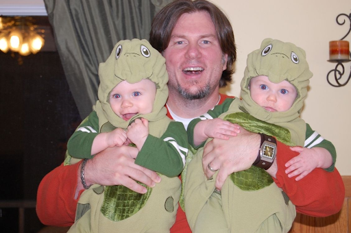 Kevin holding his twin boys for Halloween!